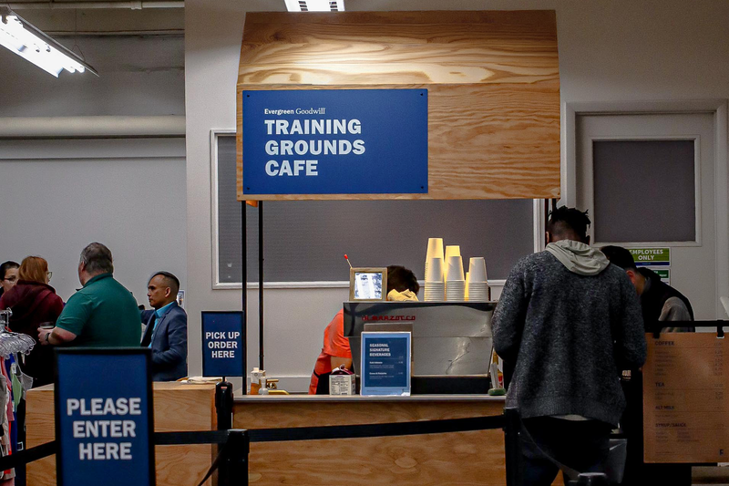 People ordering coffee at the Goodwill Training Grounds Cafe in Seattle